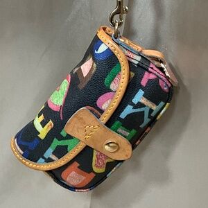 Dooney & Bourke wristlet. Full of brightly colored letters.   9-H